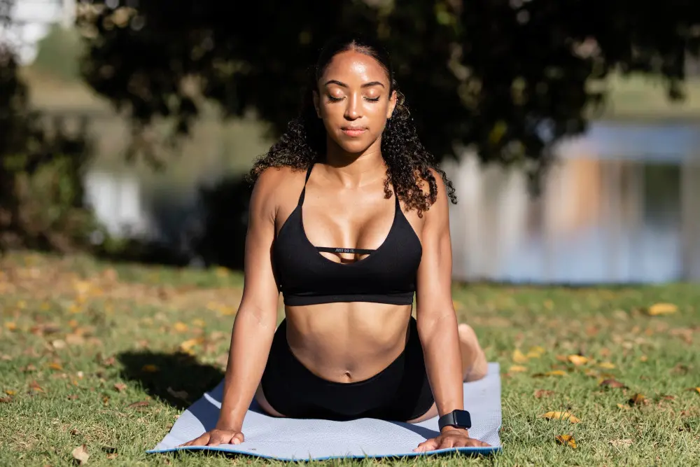 woman-doing-yoga-outside - Pacifica Center For Plastic Surgery Woman Doing Yoga
