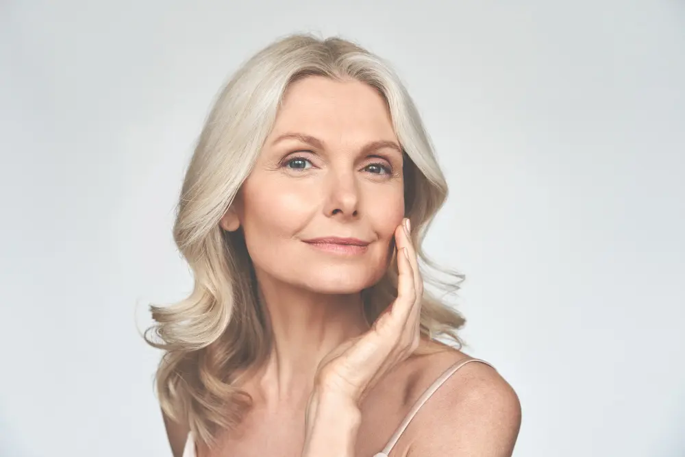 Beautiful gorgeous mid aged mature woman looking at camera isolated on white. - Pacifica Center For Plastic Surgery Older woman blonde